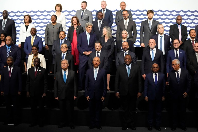 United Nations Secretary-General Antonio Guterres, Portuguese President Marcelo Rebelo de Sousa, and Kenya President Uhuru Kenyatta, center of front row, take part in a group photo at the United Nations Ocean Conference in Lisbon, Monday, June 27, 2022