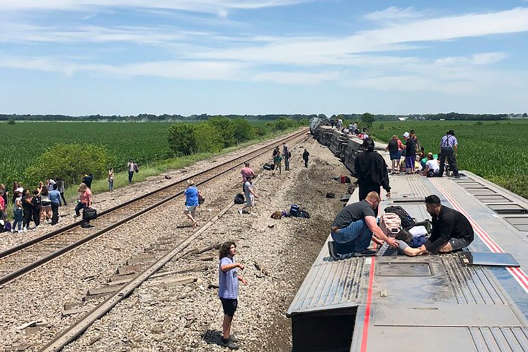 Passengers getting out of derailed train in Missouri, US.