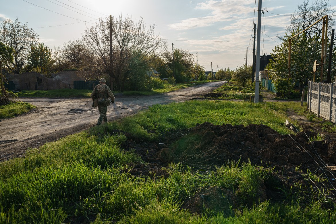 Davydenko Mykolay walks in area where the destruction caused by a Russian missile attack on Marinka.