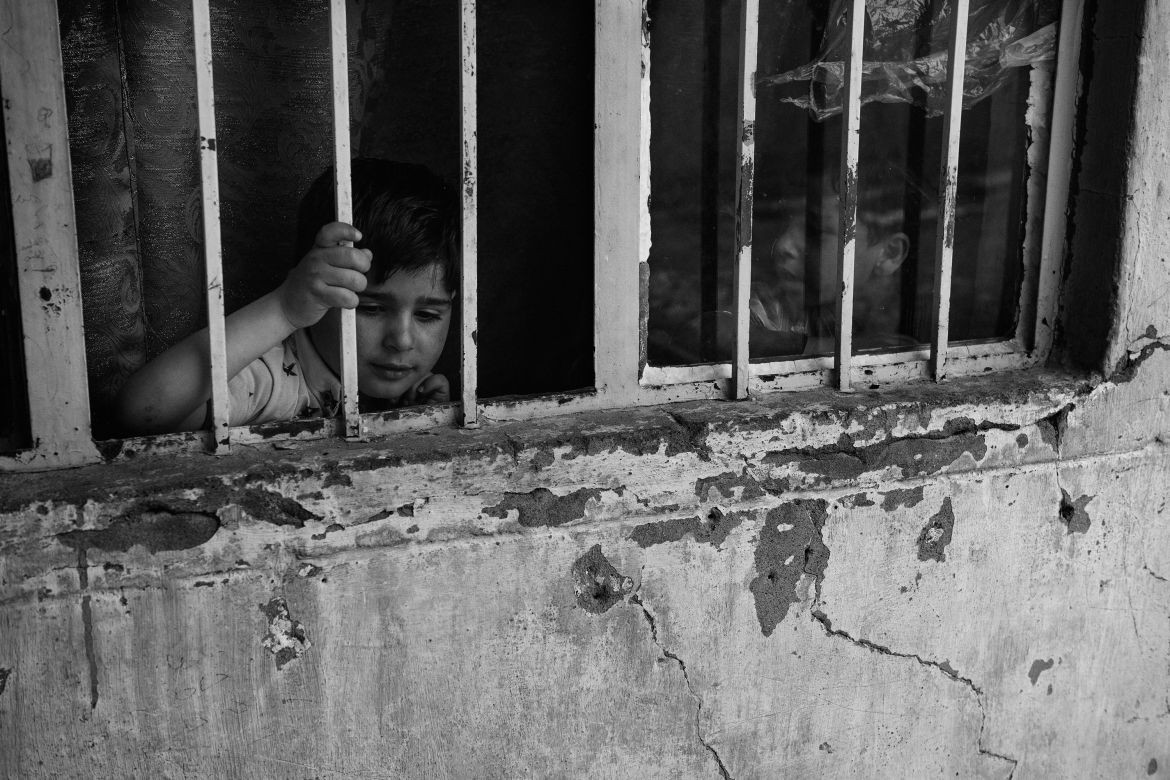 Iraq, Rabia. Children playing inside a house in Rabia.