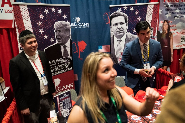 Posters of former President Donald Trump and Florida Governor Ron DeSantis are seen during the first day of the Conservative Political Action Conference