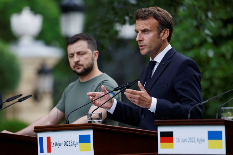 French President Emmanuel Macron speaks as Ukrainian President Volodymyr Zelenskiy listens during a joint news conference in Kyiv, Ukraine June 16, 2022
