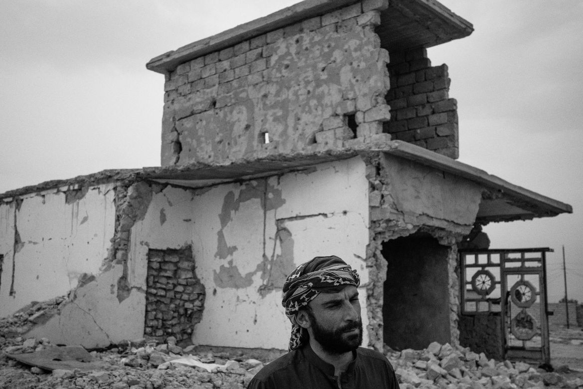 Iraq, Baiji. Portrait of Thaer Khaleel Sahan. He said: “In 2014 ISIS entered the city of Baiji. We remained there 4 months, then we went to Ramadi and then we came to Tikrit, and we stayed for one and a half year in the camp. When the area was safe, we came back and found our house destroyed. We can’t afford to rebuild it, so we stayed in a small house nearby. Life is difficult, everything is difficult, we haven’t the means to rebuild it like it was before, so we left it like this. The police came and told us to leave the camp and that the camp will be closed soon. They forced us to leave and they told us: ‘Go to Baiji to your homes’. I really hope that the government will rebuild my house. That’s all I dream of”.