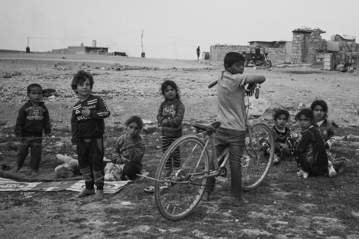 Iraq, Mosul. Children playing in the outskirts of Mosul. Poor areas are considered by ISIS good places for recruitment