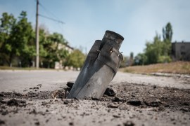 An Unexploded Ordnance is embedded on a road in Severodonetsk, eastern Ukraine.