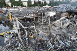 Rescuers work at a site of a shopping mall hit by a Russian missile strike, in Kremenchuk, Poltava region, Ukraine [Press service of the State Emergency Service of Ukraine/Handout via Reuters]