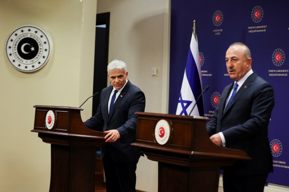 Israel's foreign minister Yair Lapid and his Turkish counterpart Mevlut Cavusoglu attend a news conference