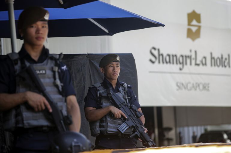Two members of Singapore's Gurkha Contingent guarding the entrance to the Shangri-La Hotel during the last summit in 2019