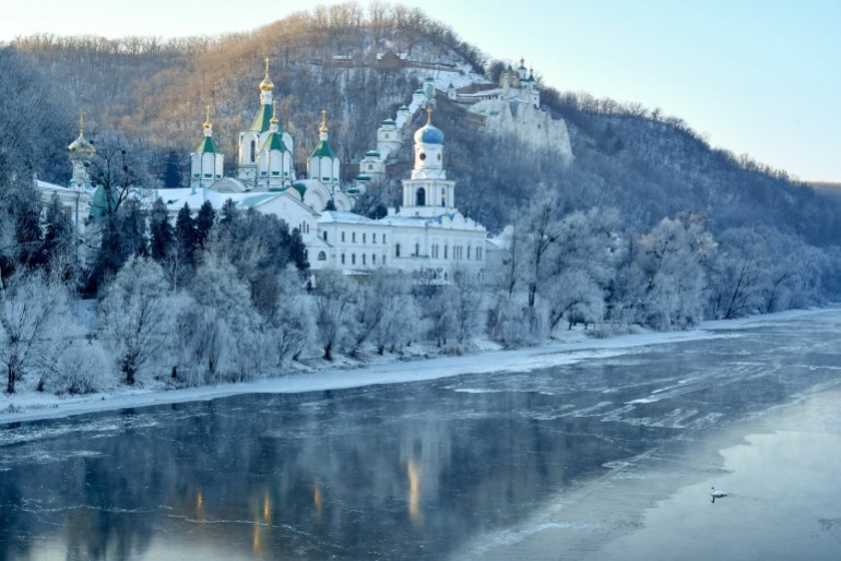 The Holy Mountains Lavra of the Holy Dormition, a major Orthodox Christian monastery, during winter sunrise on the steep right bank of the Seversky Donets River near the town of Sviatohirsk in Donetsk region of eastern Ukraine