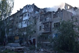 A rescuer stands next to a residential building hit by a Russian military raid, as Russia&#39;s attack on Ukraine continues, in Mykolaiv, Ukraine, June 29, 2022 [Press service of the State Emergency Service of Ukraine/Handout via Reuters]