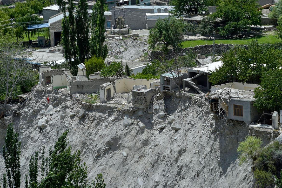 In this picture taken on June 9, 2022, a general view shows damaged houses after they were swept away by a lake outburst because of a melting glacier, in Hassanabad village