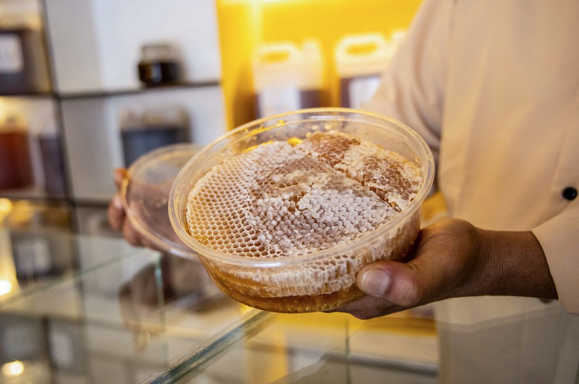 A Yemeni vendor shows a packaged honeycomb