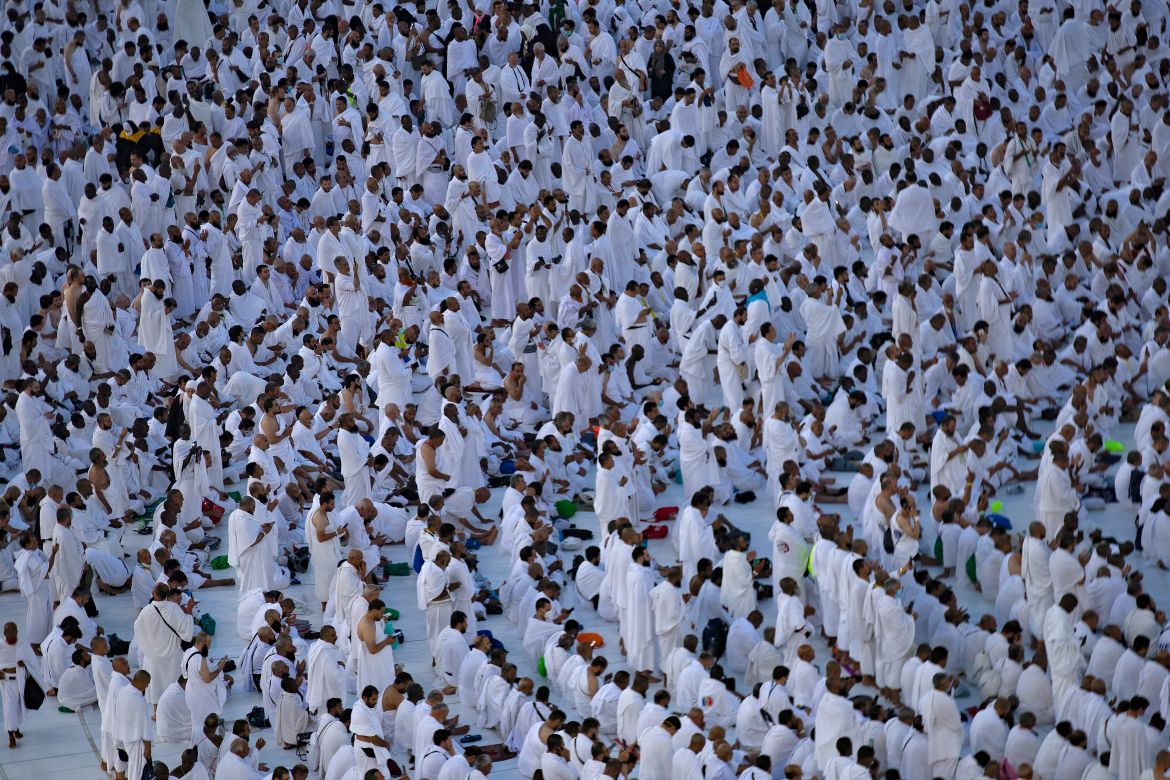 Muslim worshippers pray around the Kaaba