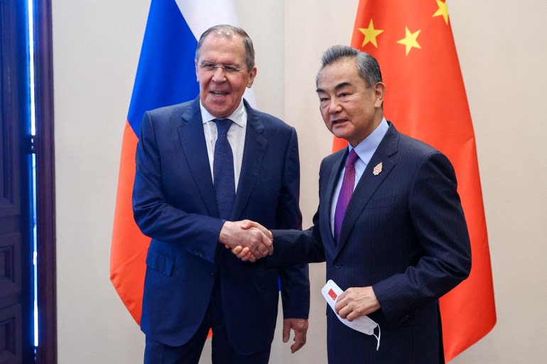 Russian Foreign Minister Sergey Lavrov meets with his Chinese counterpart Wang Yi