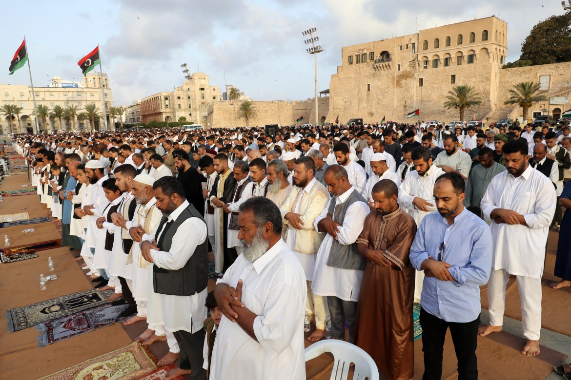 Muslims perform the morning prayer in the Libyan capital Tripoli