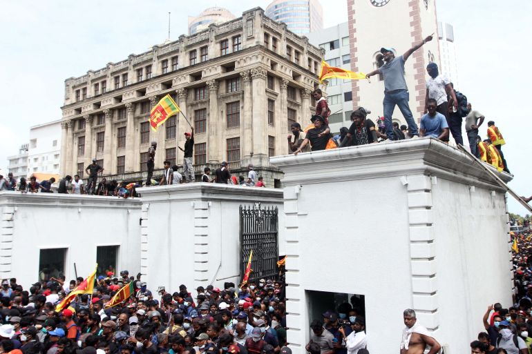 Protesters demanding the resignation of Sri Lanka's President Gotabaya Rajapaksa gather inside the compound of Sri Lanka's Presidential Palace in Colombo on July 9, 2022