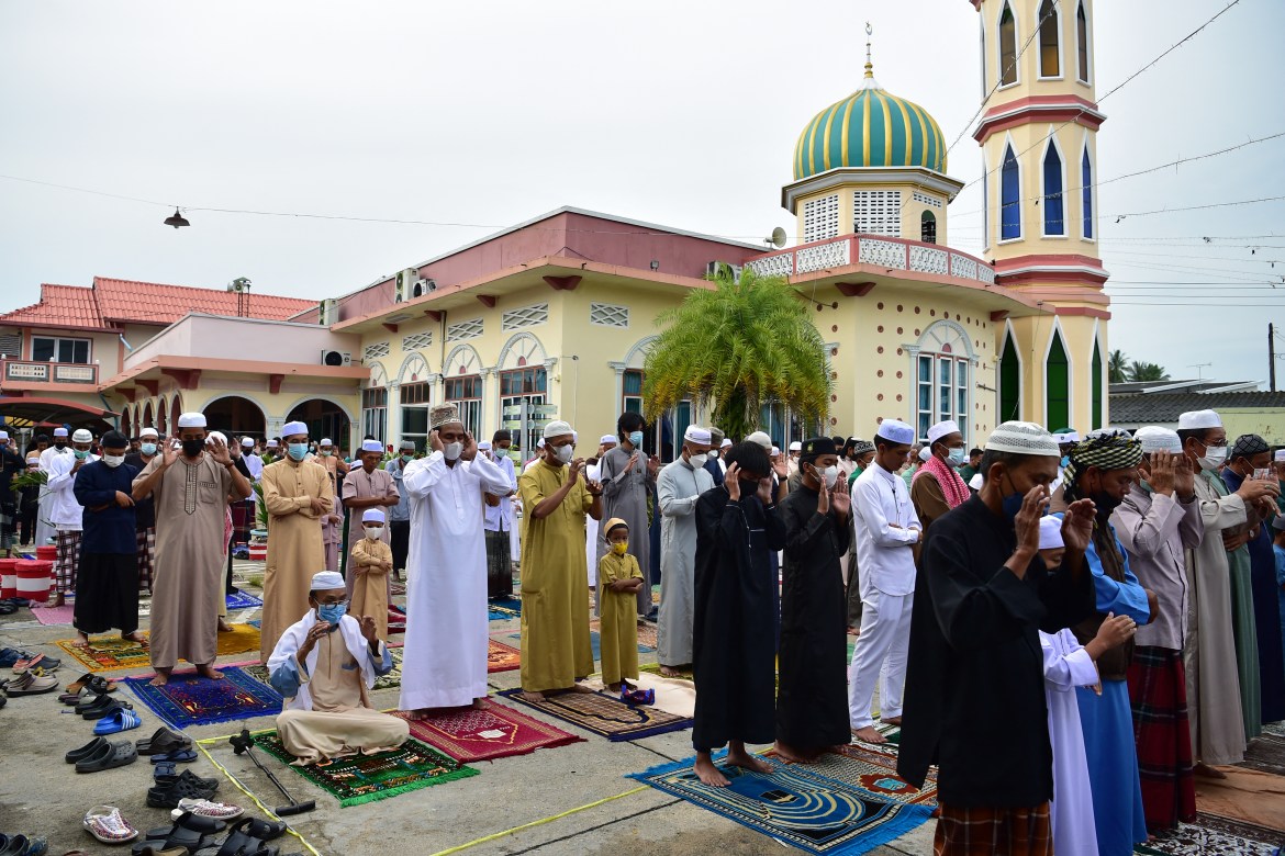 Thai Muslims gather to pray at a mosque during the Islamic Eid al-Adha