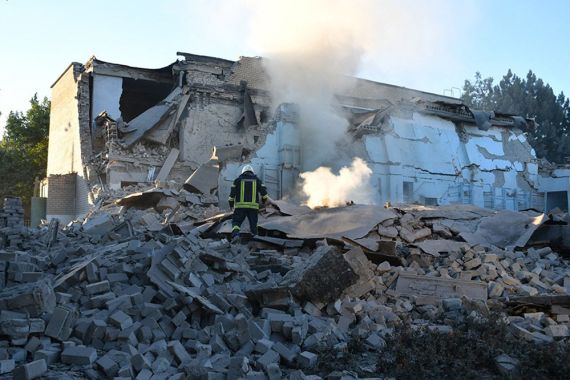 This handout picture taken and released by Ukrainian Emergency Service on July 14, 2022 shows rescuers working on a residential building partialy destroyed by missile strike in the Bashtanka, Mykolaiv district amid the Russian invasion of the Ukraine.