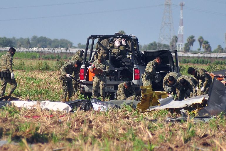 Soldiers of the Mexican Army work at the site of a Navy helicopter crash near the airport of Los Mochis, Sinaloa State, Mexico