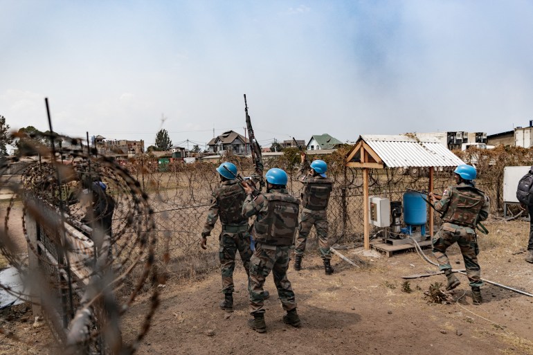 MONUSCO troops try to repel a protest