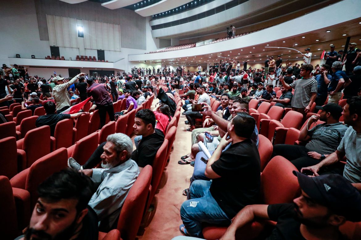 Supporters of the Iraqi cleric Moqtada Sadr gather inside the Iraqi parliament