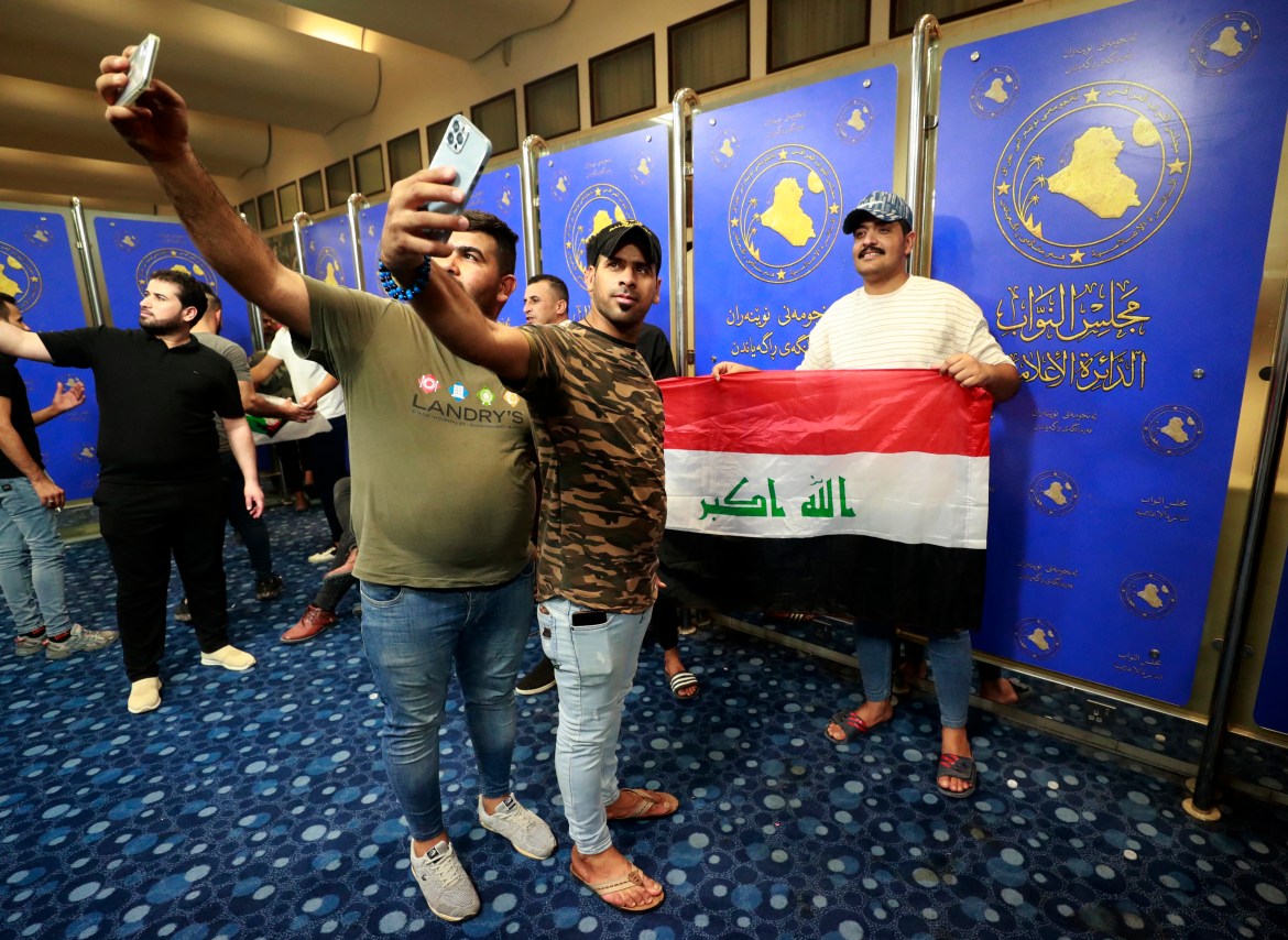 Supporters of the Iraqi cleric Moqtada Sadr gather inside the Iraqi parliament