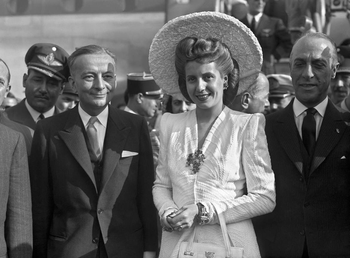 French foreign minister Georges Bidault (R) greets Argentinean Eva Peron, 21 July 1947, as she arrives at Orly airport for a visit in France. Eva Peron, known as Evita (1919-1952), the second wife of Argentine President Juan Peron, was a radio and screen actress before her marriage in 1945. She became a powerful political influence and a mainstay of the Peron government. She was idolized by the poor, and after her death, in Buenos Aires, support for her husband waned. AFP PHOTO (Photo by PIGISTE / AFP)