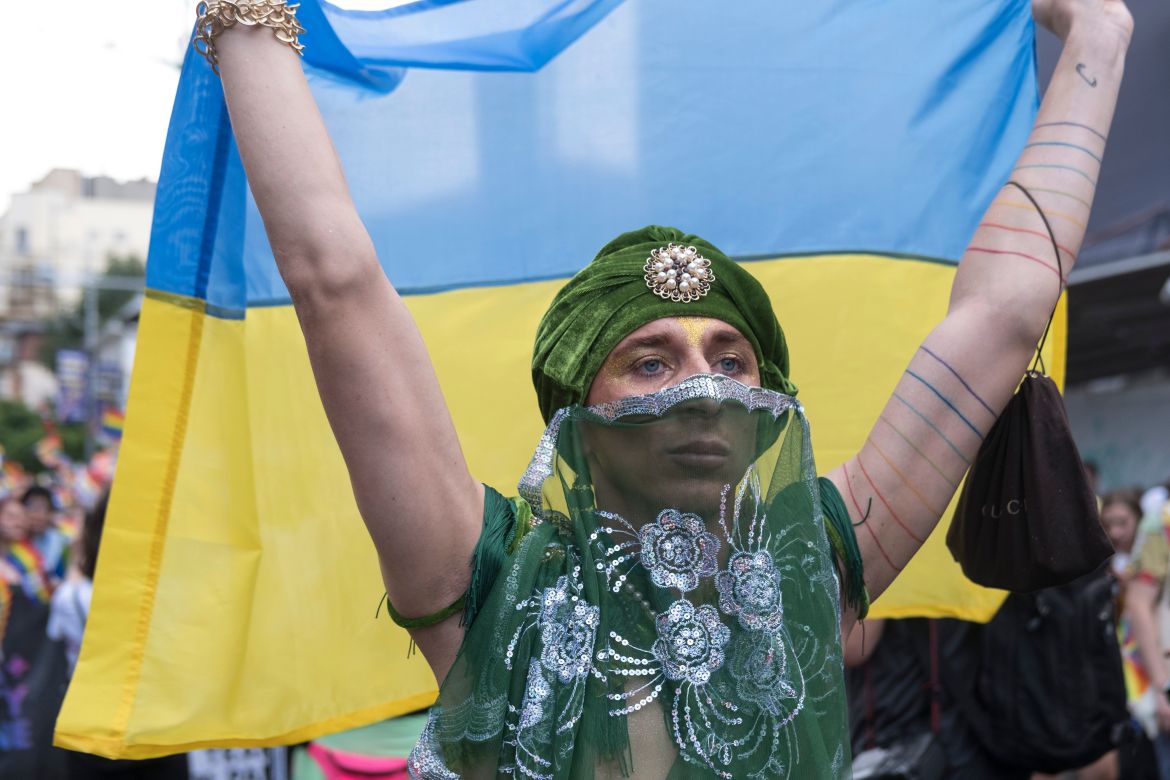 A Ukrainian dancer waved his national flag in a message against war during Bucharest Pride.