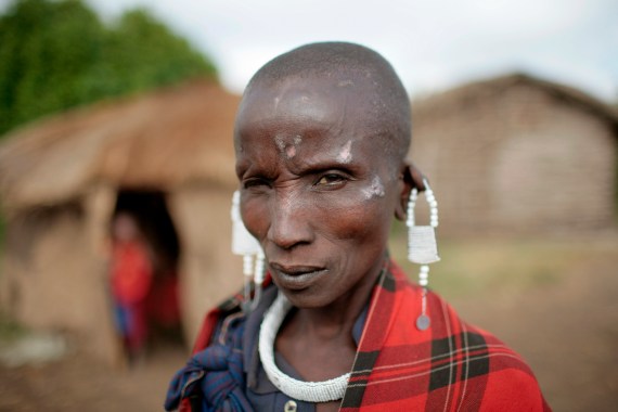 A Maasai woman displays hand made earrings made and sold in her village outside of Ngorongoro Crater, Tanzania.