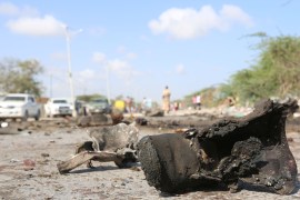 A military boot is seen at the scene of a suicide car bomb attack by al Shabaab in Somalia's capital Mogadishu