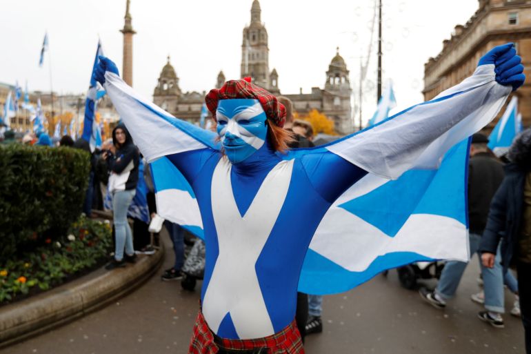 A demonstrator holds a flag during a pro-Scottish Independence rally in Glasgow.