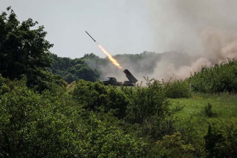 Ukrainian service members fire a BM-21 Grad multiple rocket launch system, near the town of Lysychansk, Ukraine.