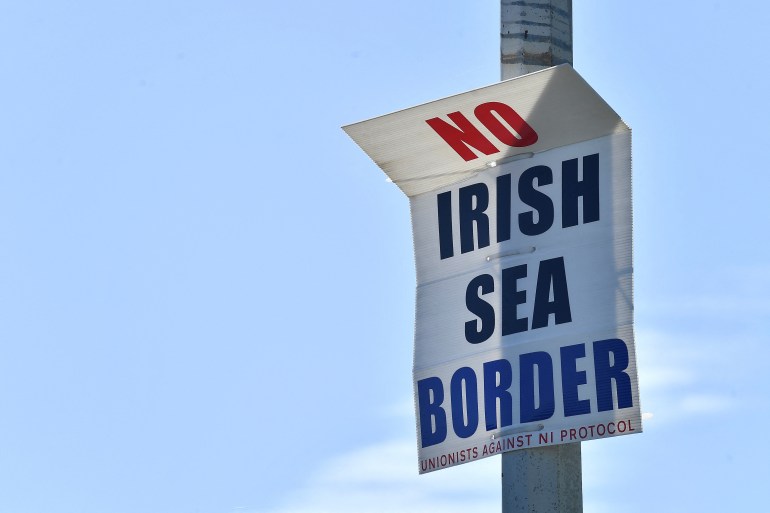 A poster reading "no Irish Sea border" is seen at the port in Larne, Northern Ireland 