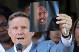 Lawyer Bobby DiCello holds up a photograph of Jayland Walker, who was fatally shot by police in Akron, Ohio [File: Jeff Lange/USA Today Network via Reuters]