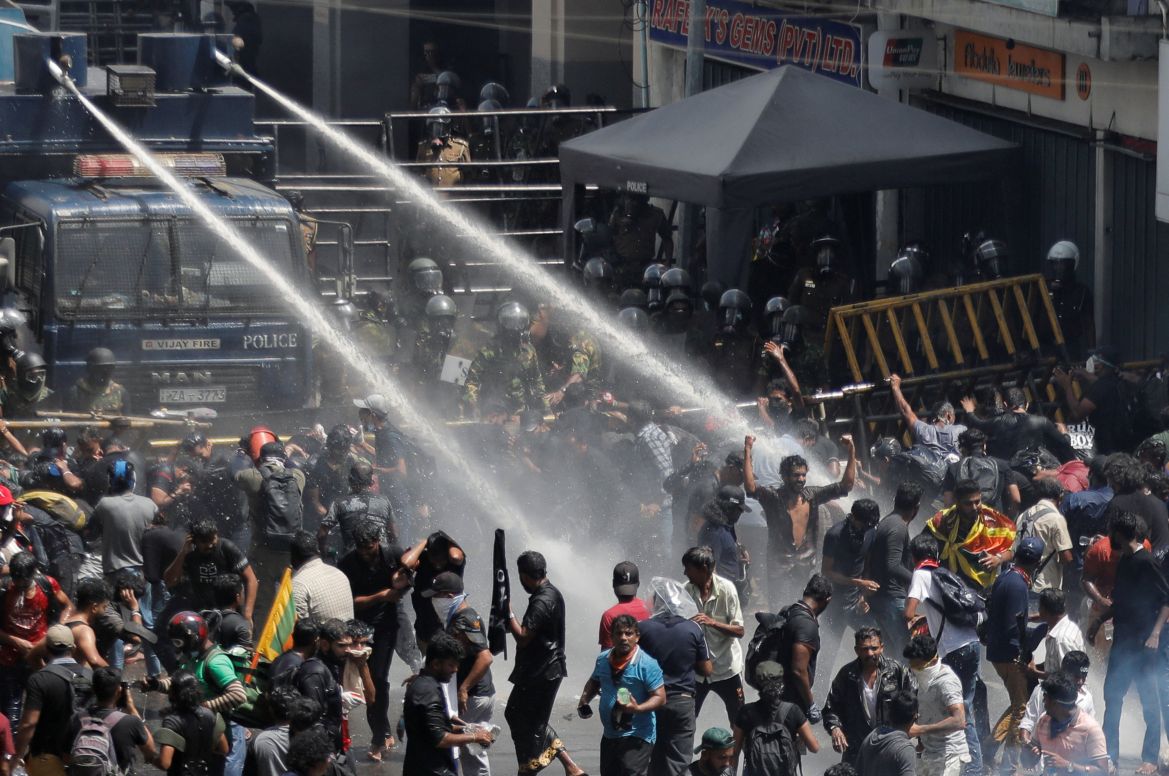Police uses water cannons to disperse demonstrators near President's residence during a protest