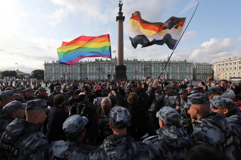 FILE PHOTO: Law enforcement officers block participants of the LGBT community rally "X St.Petersburg Pride" in central Saint Petersburg, Russia August 3, 2019.