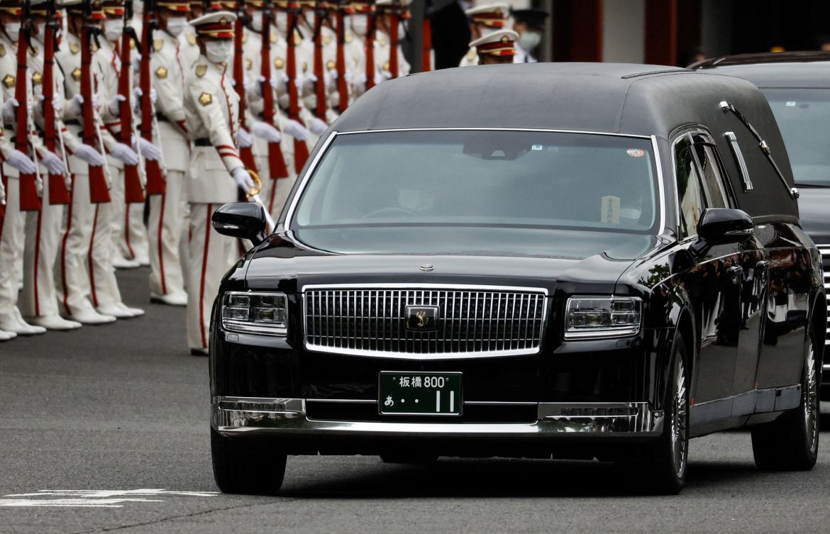 Akie Abe, wife of late former Japanese Prime Minister Shinzo Abe, who was shot while campaigning for a parliamentary election, sits in a vehicle carrying Abe's body, as she leaves after his funeral at Zojoji Temple in Tokyo