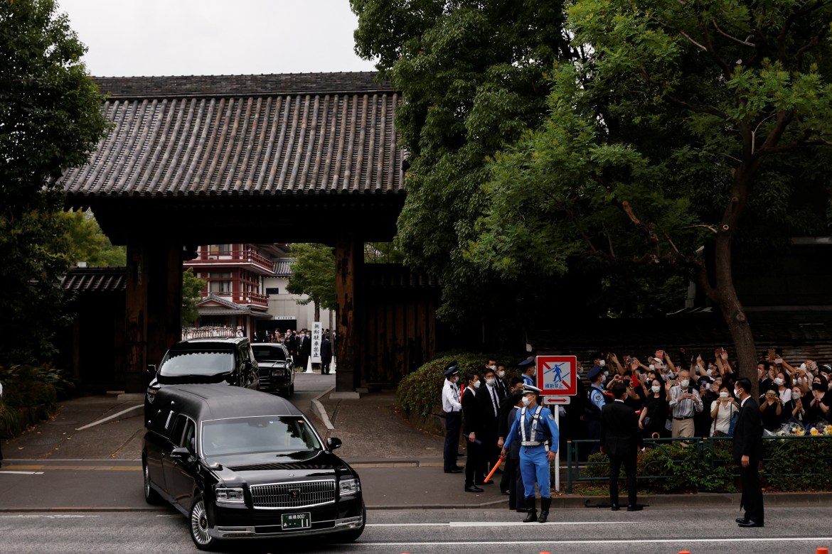 Motorcade carrying the body of the late former Japanese Prime Minister Shinzo Abe, who was shot while campaigning for a parliamentary election, leaves after his funeral at Zojoji Temple