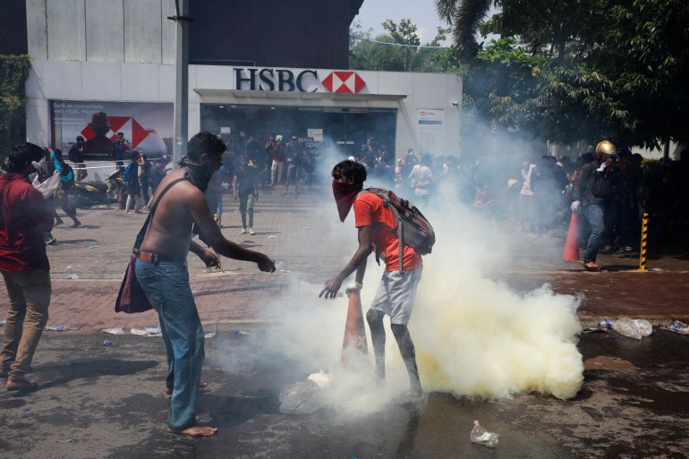 Demonstrators attend a protest outside the office of Sri Lanka's Prime Minister Ranil Wickremesinghe