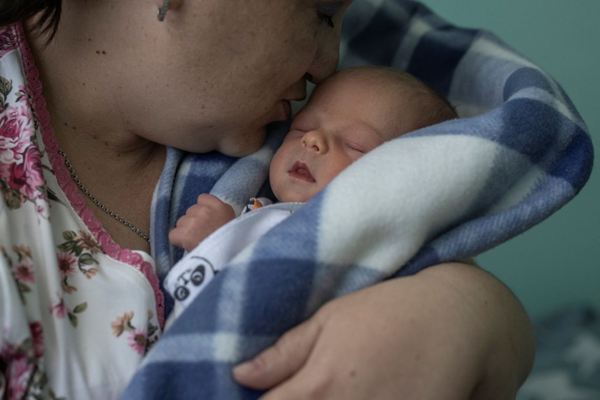 Iryna Salamatina, 36, kisses her son Anton inside Pokrovsk maternity hospital