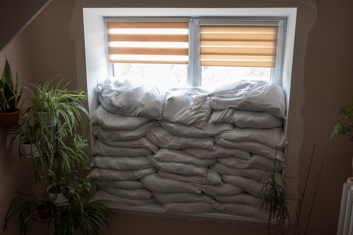 Sandbags are seen piled in front of a window inside Pokrovsk maternity hospital