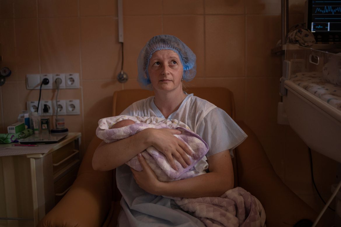 Katya Buravtsova, 35, holds her son Illiusha inside Pokrovsk maternity hospital,