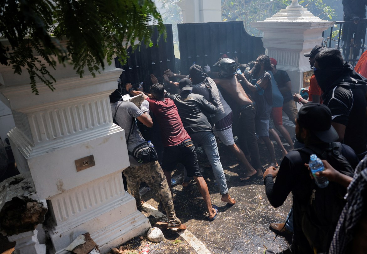 Demonstrators break the gate of Sri Lankan Prime Minister Ranil Wickremasinghe's office