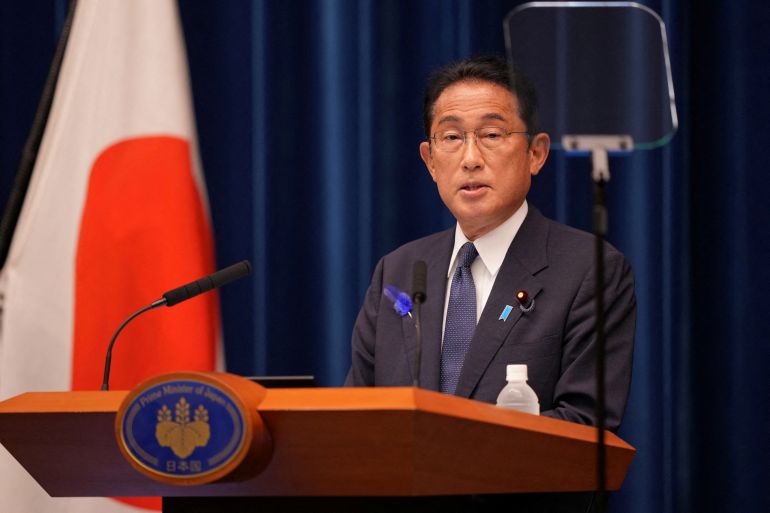 Japan's Prime Minister Fumio Kishida speaking at a lectern.