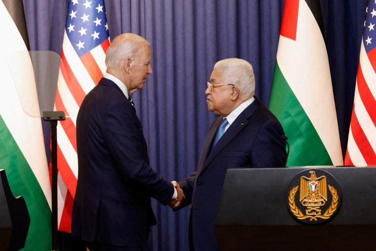 Palestinian President Mahmoud Abbas and U.S. President Joe Biden shake hands after a statement, in Bethlehem