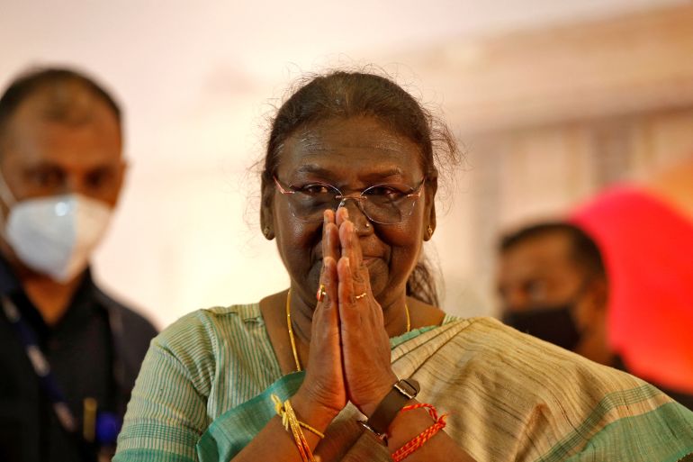 Droupadi Murmu clasps her hands in greeting