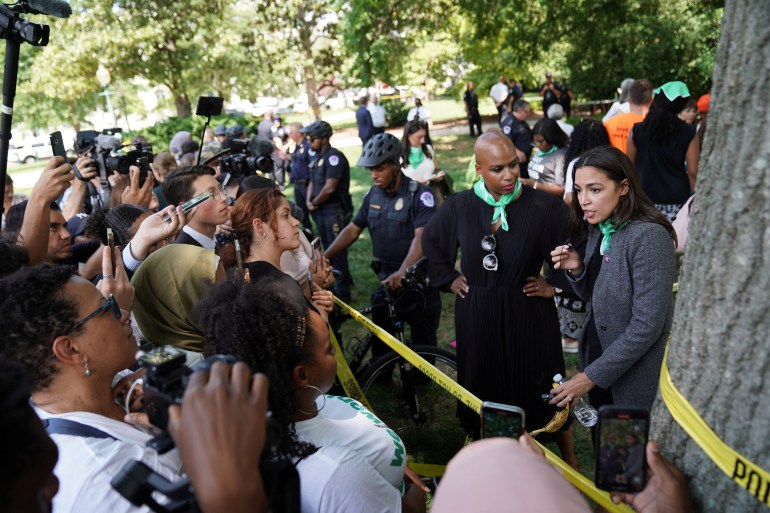 Representatives Ayanna Pressley and Alexandria Ocasio-Cortez speak to the press while detained for their part in an abortion rights protest