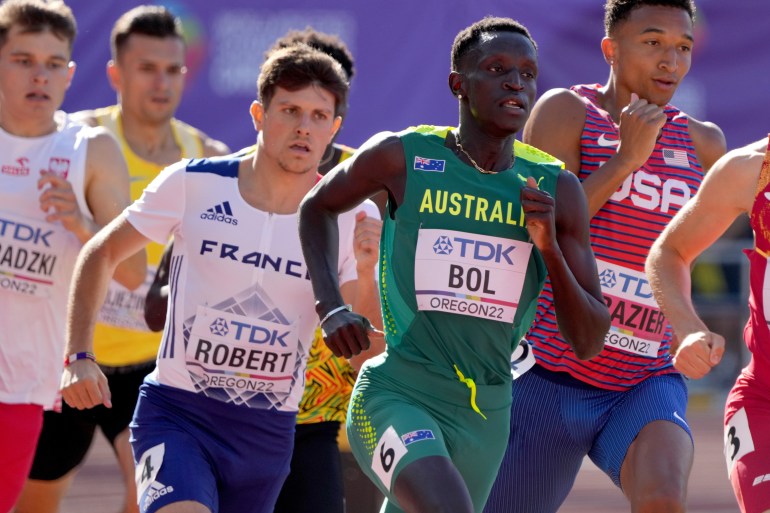 Peter Bol, in the green and gold colours of Australia, runs in the World Athletics Championships.