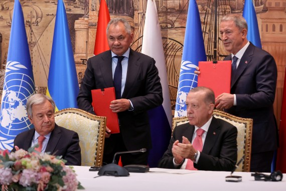 U.N. Secretary-General Antonio Guterres, Russia's Defence Minister Sergei Shoigu and Turkish President Recep Tayyip Erdogan at the signing ceremony in Istanbul