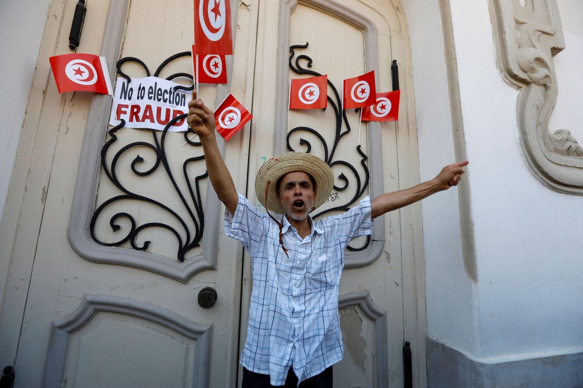 A demonstrator takes part in a protest against President Kais Saied